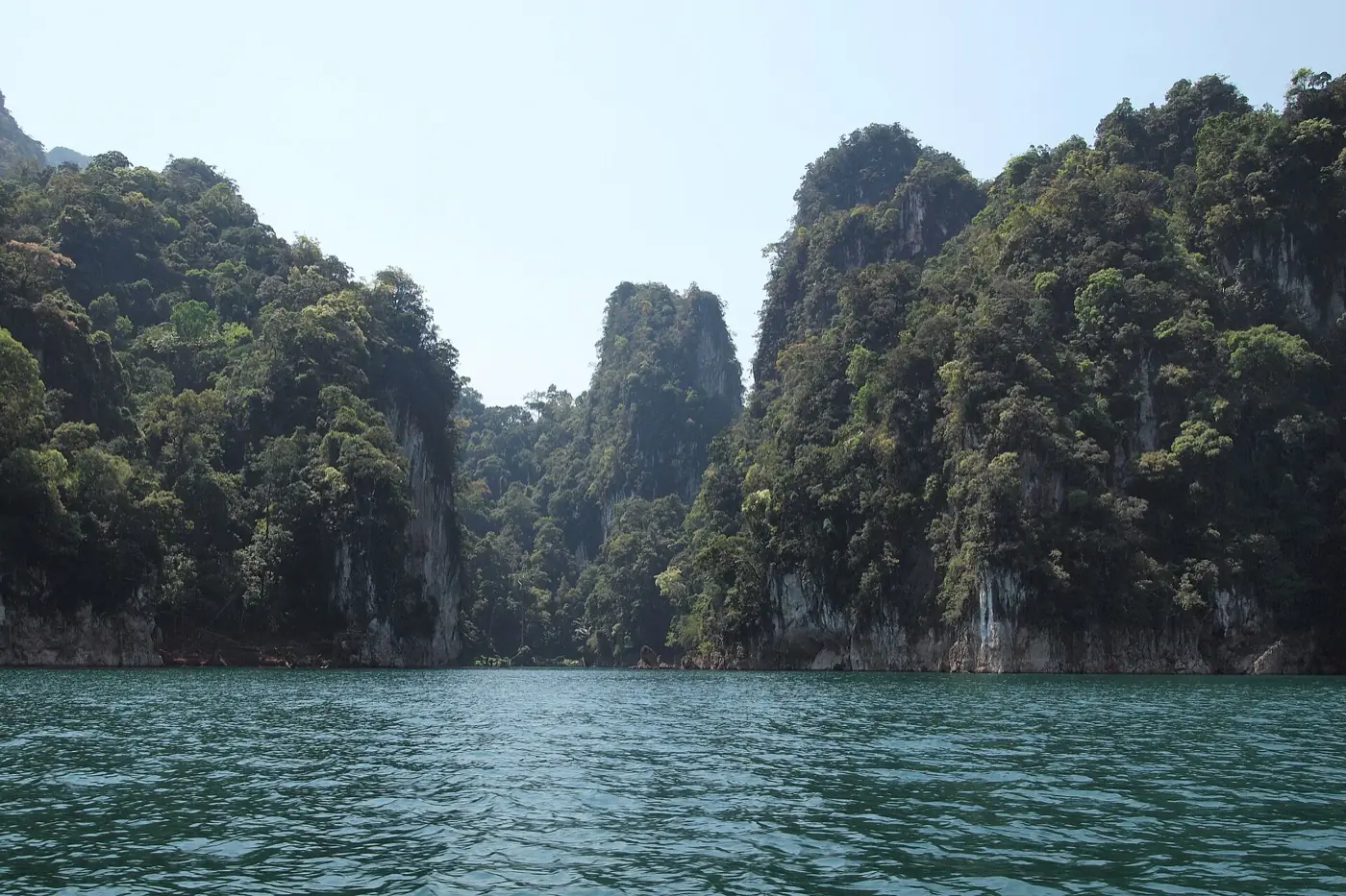 Limestone cliffs rising straight out of the water at Cheow Lan Lake, Khao Sok